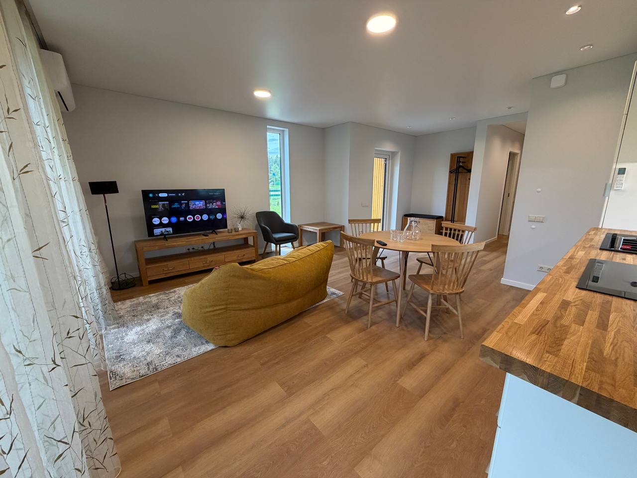 Living room with smart TV, dining table and kitchen — N58 Carnikava