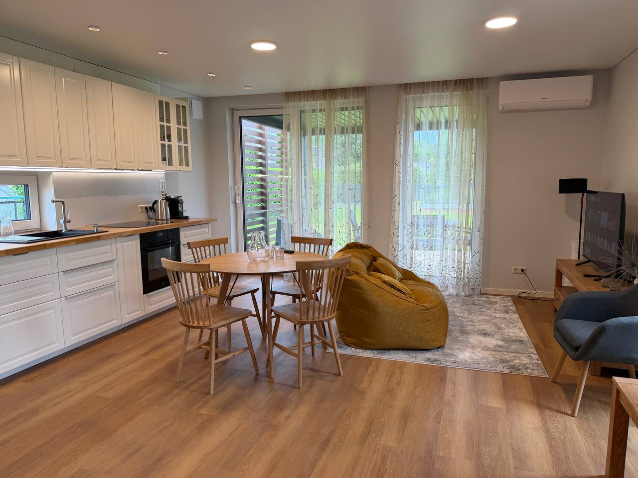 Open-plan living and dining area with view to terrace — N58 Carnikava